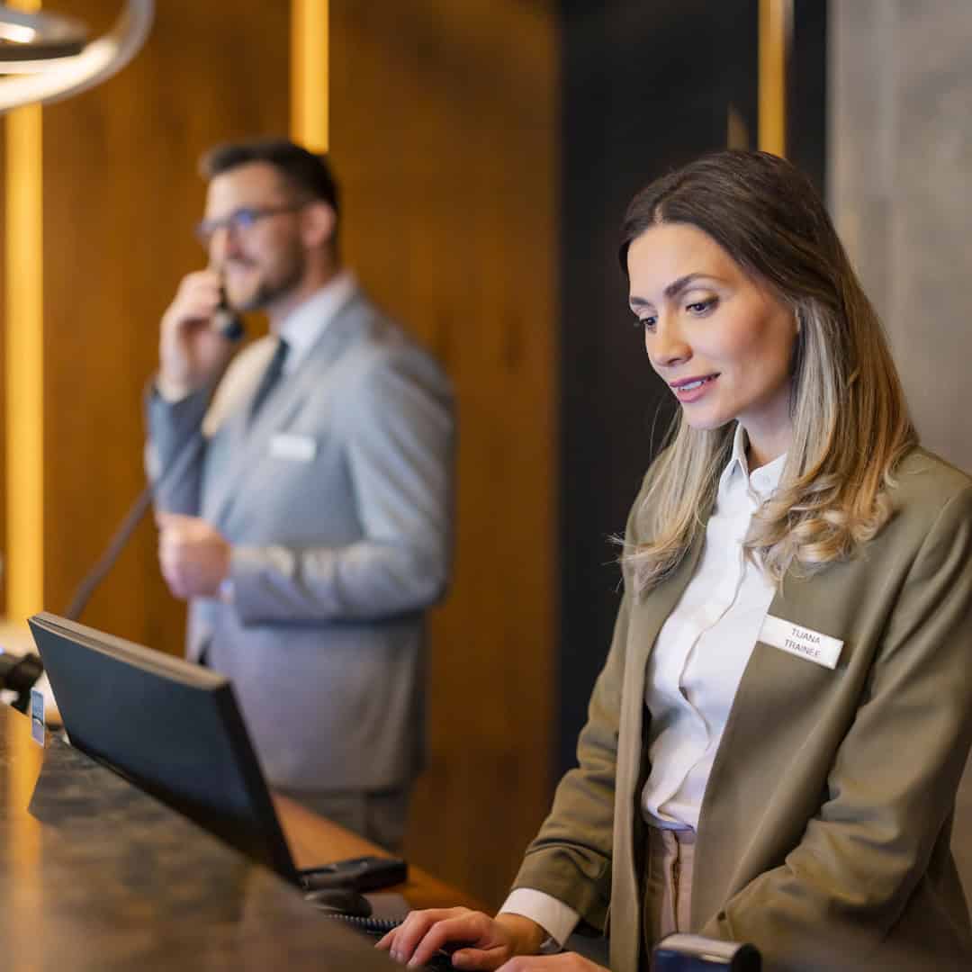 Hotel Concierge answering phones in hotel.